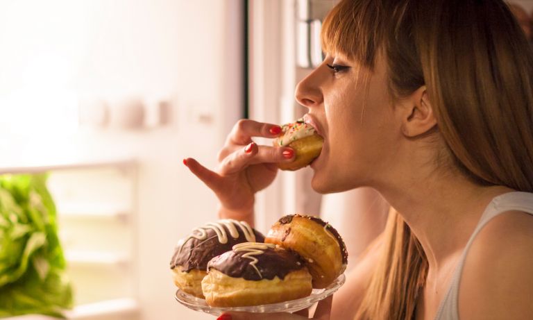 young-woman-having-a-midnight-snack-768